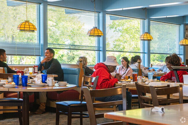 Friends & family enjoy a meal together at Nikarry's Restaurant in Aurora's North River area.