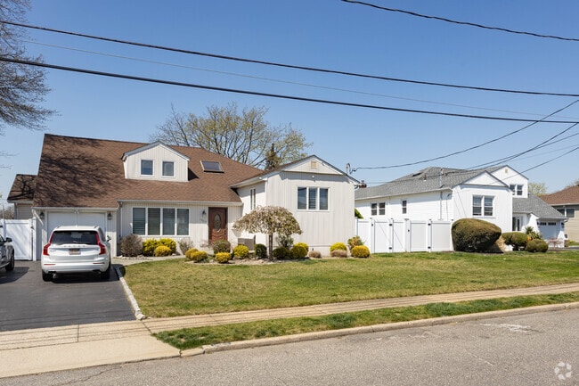 Modest split-level homes can be found in Merrick as you head north of the beach.