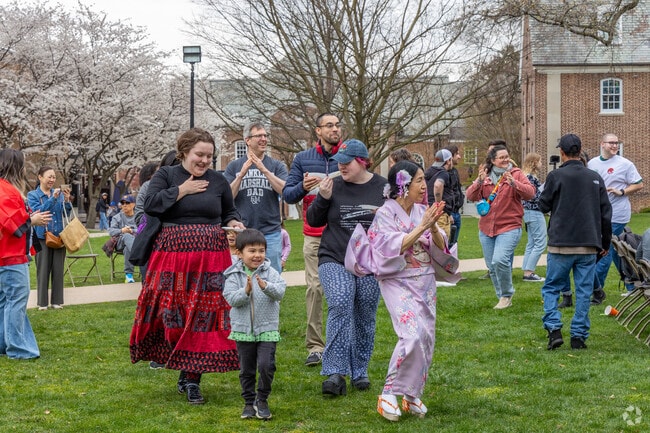 Attendees join along in a traditional Japanese dance at Sakura Festival in College Park.