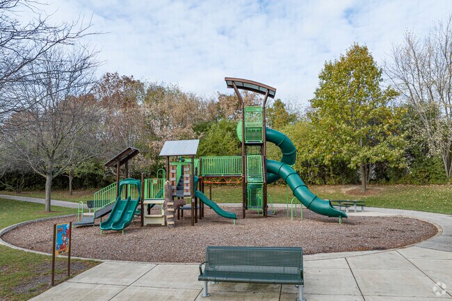Kids climb and play while parents relax in Southeast Batavia’s Big Woods Park.