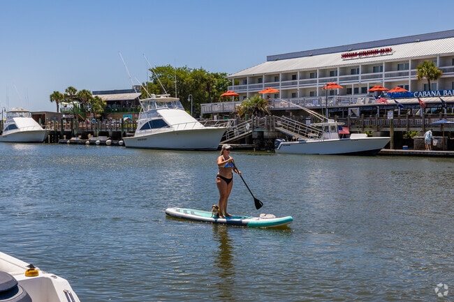 Old Village residents love to paddle board with their dog in Mount Pleasant.