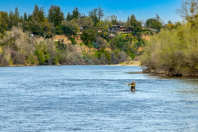 A fly fisherman enjoys a trip on the American River near Carmichael Town Center.