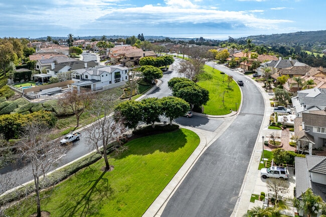 Crest de Ville neighborhood has well kept streets with green spaces.