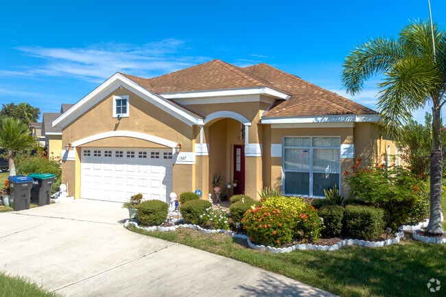 Two-car garages are a common amenity and large windows help let in as much bright Florida sun.