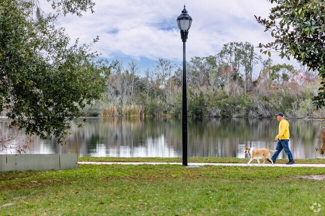 Residents lve to walk along the shores at Secret Lake Park in Casselberry.