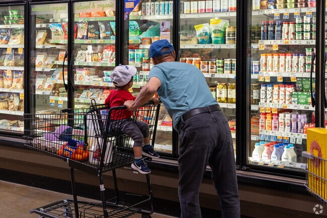Families often shop together at the QFC shopping market.
