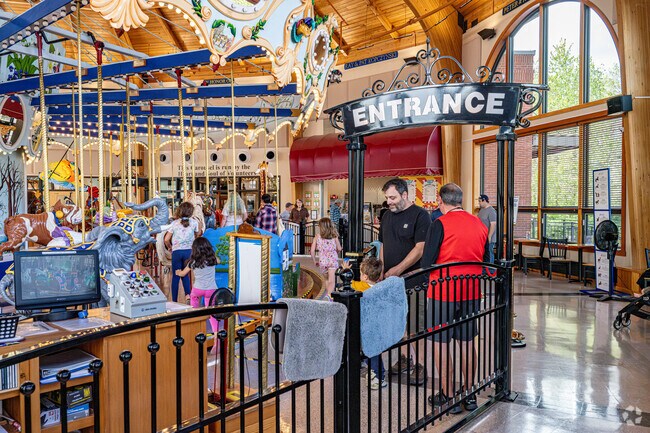 Visitors admire the craftsmanship of the Albany Historical Carousel and Museum.