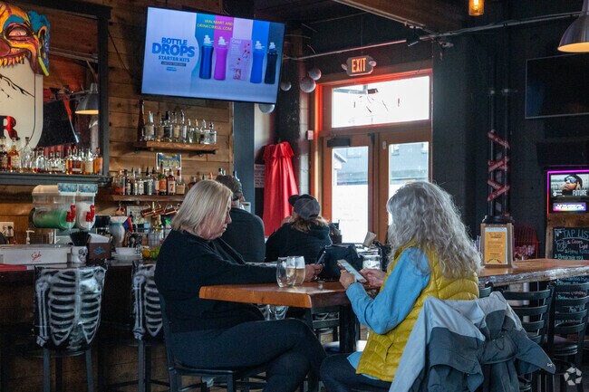 Residents of the Hollybrook neighborhood enjoy a beer at Cedarville Inn.