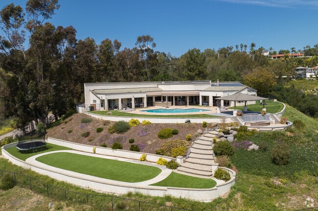 A modern contemporary home with a private pool and putting green in Lake Hodges.