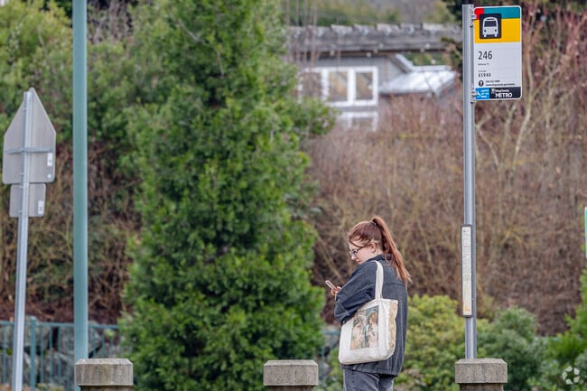 Bus riders often wait along Yarrow Point’s quiet residential streets.