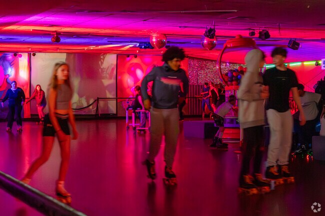 Teens enjoy a lively night of skating under neon lights at Wigwam Skate near Sheridan Park.