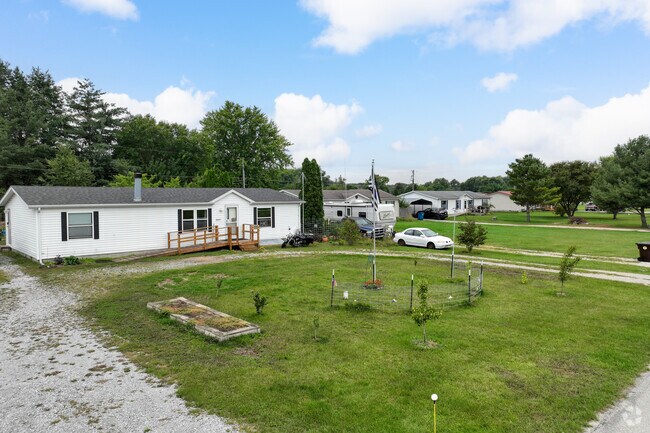Rows of ranch style homes sit far off the road for plenty of room in the front yard.