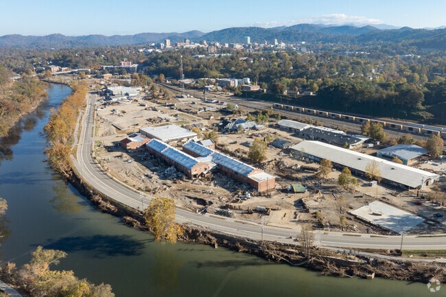 Asheville sits between the river and the mountains, a city in recovery but not giving up hope.