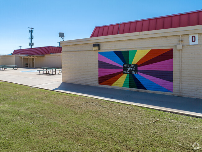 This brightly colored mural adorns this wall at Salk Elementary School.