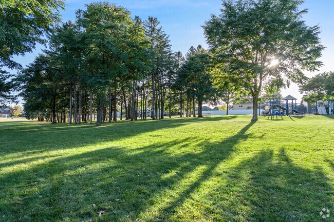 Shaded areas and vast green lawns at Hart Farm Park invite relaxation and casual outdoor fun.