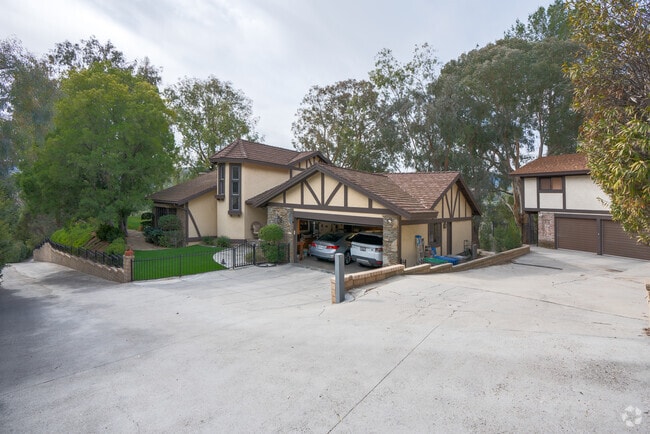 This hillside Tudor estate in Newhall offers plenty of privacy from neighbors.