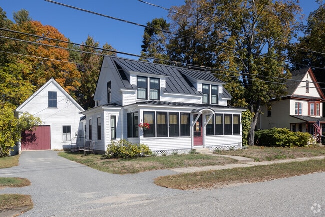 This cozy cape home with it's shed dormers can be found in Porter.