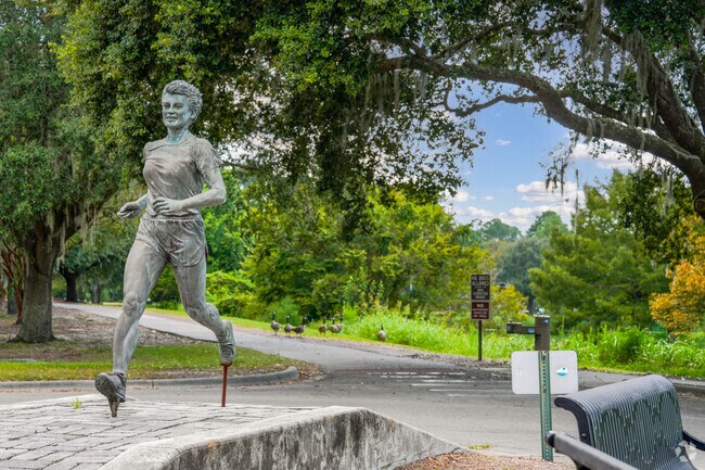 At Lake Mayer Park's entrance, a statue honors beloved Julie Backus Smith.