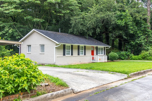 An updated ranch style home with a colorful door in the Thomasville Heights neighborhood.