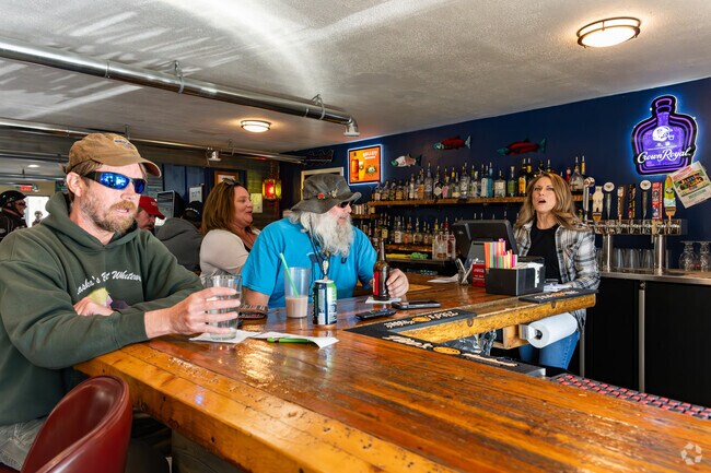 Patrons of the Fishhook Bar and Grill get a good conversation on.