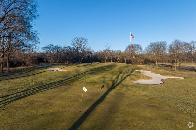 A golf course with lush fairways and challenging greens,