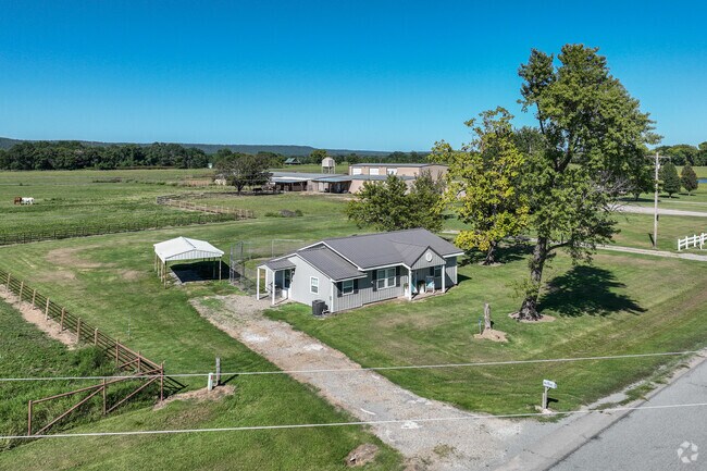 Find ranch style homes with car ports and acreage in Brent.