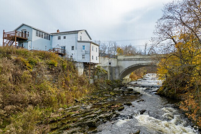 A river runs through the area of Eastside Troy where you'll find rustic homes.