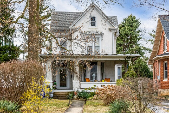 Quaint Victorian-style homes are nestled in landscaping on Market Street.