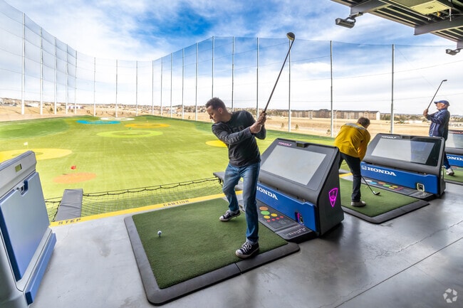 Have some fun hitting the balls at TopGolf near the Flying Horse Ranch neighborhood.