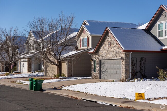 Larger homes with beautiful brickwork and multi-car garages line Jackson Farm streets.