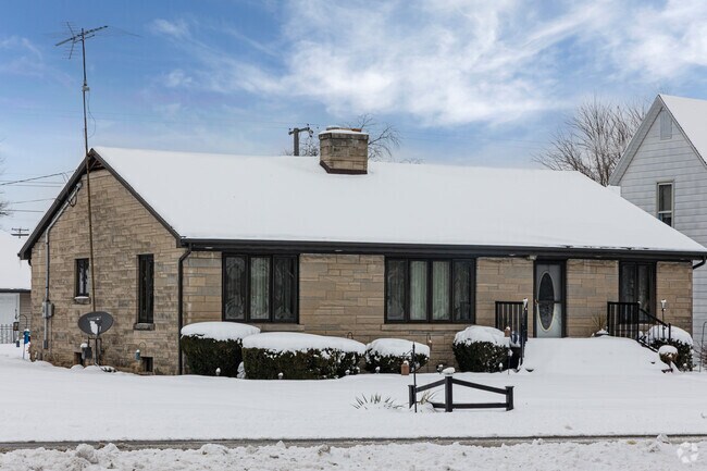 Modern ranch-style home in Morocco features stone exterior and single-level layout.
