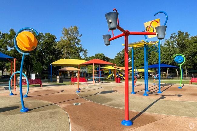 Young Downtown Conway residents enjoy the splash pad at Laurel Park in summer.