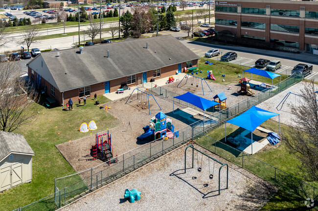 Kids can enjoy playing outdoors on the playground at The Montessori School of Five Points.