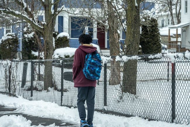 A boy walks along Dorchester Street in Union Hill, Worcester.