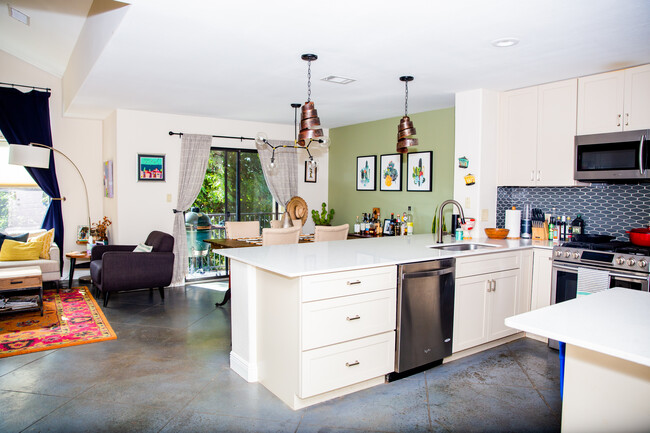Open kitchen, dining, and living area.