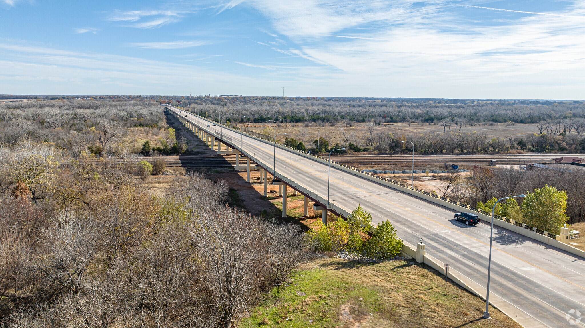 A bridge connects peaceful Slaughterville with lively Purcell, OK.
