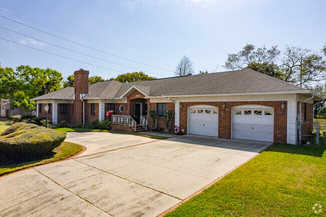 Brick home with a two-car garage in Midtown Tampa.
