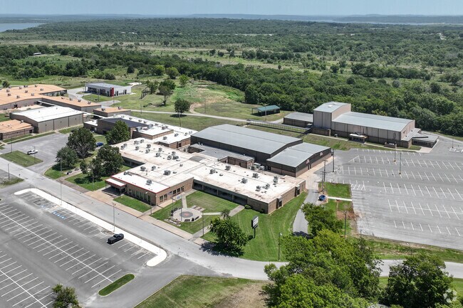 Wagoner High School sits on a serene campus surrounded by green space and mature trees.
