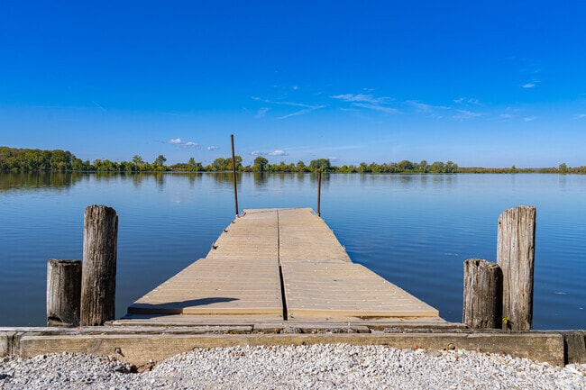 A long pier juts out from the shore of Creve Coeur Lake in Maryland Heights.