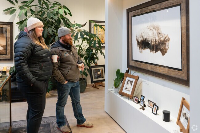 A visiting couple enjoy the artwork at Medicine Bird Gallery in Livingston.