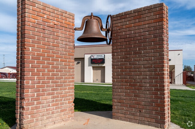 The bell still stands near the entrance of Standard Middle School.