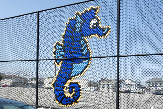 The Seahorse mascot hangs on the yard fence at the West Elementary School in Long Beach, NY.