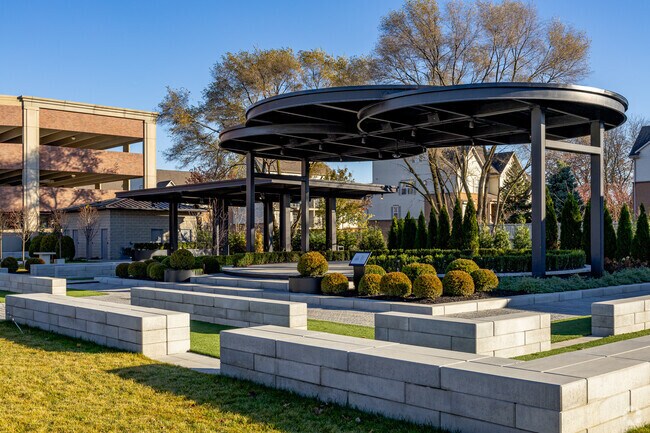 Dearborn Peace Park West's event stage is surrounded by perfectly manicured greenery.