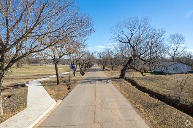 The road leading to Chandler's schools is tree-lined along the baseball/softball fields.