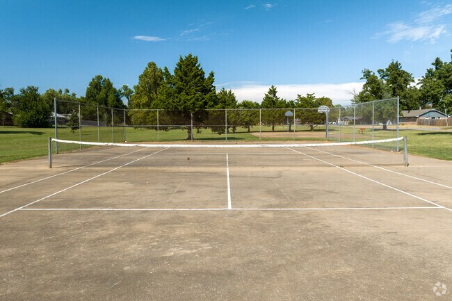 There is a tennis court at Meadow Lakes Park.