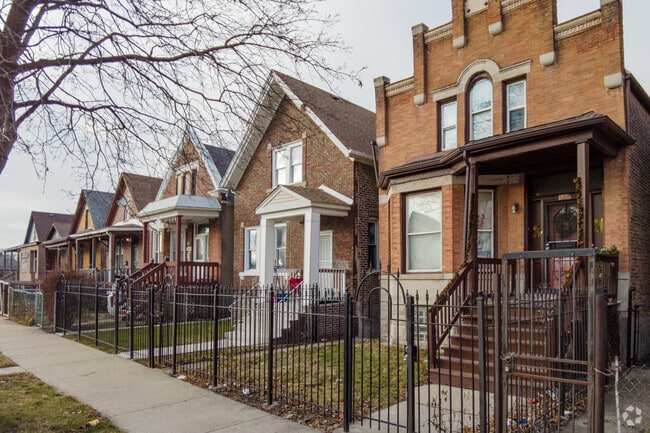 Residents appreciate their fenced-in fronts in Little Village.