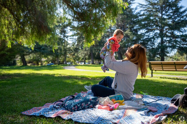 Lovingly cradling her precious bundle of joy.