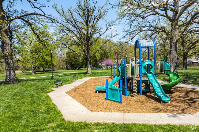 Country Club Park offers open green space, tall shade trees, and a colorful playground that makes it a favorite spot for families to relax and play.