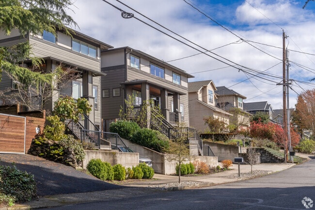A row of newly built traditional homes in the Hillsdale neighborhood.