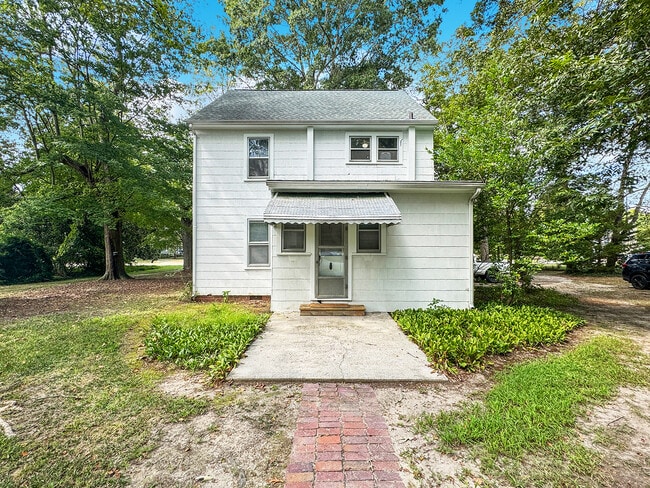 Unit A entrance in rear if of house.